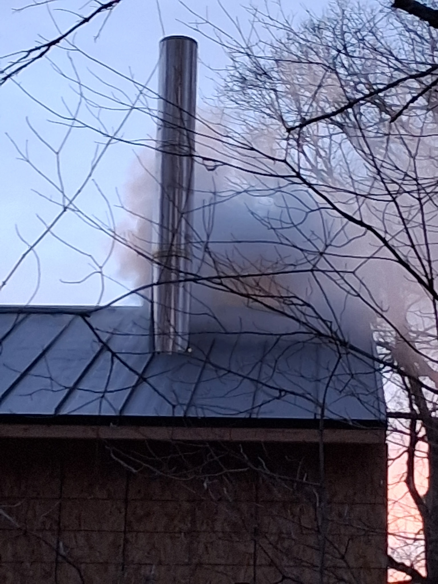Steam rising from the Minnesota Maple sugarhouse